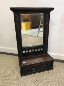 A 19th Century oak hall mirror in the 17