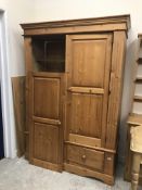 A modern pine wardrobe with two cupboard