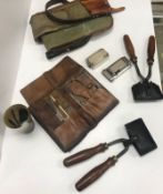 A leather cartridge bag with canvas stra