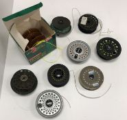 A collection of various fly reels includ