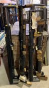 A collection of 12 black painted metal board rigging sections, stencilled 