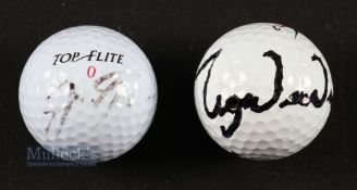 Jack Nicklaus and Tiger Woods signed golf balls - the two of the most successful golfers of all time