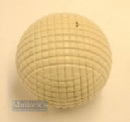 Fine and original and unused moulded mesh large guttie golf ball - with all the original white paint