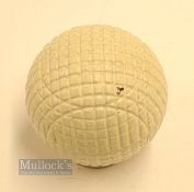 Fine and original and unused moulded mesh small guttie golf ball - with all the original white paint