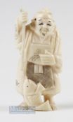 Small Antique Japanese Carved Marine Ivory Fishing figure with spear and fish, 7cm tall, has some
