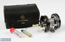 ABU Ambassadeur 5000C multiplying reel in black finish, foot stamped 30710, twin handled, with spare