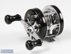 ABU Ambassadeur 4600C multiplying reel in black finish, foot stamped 780200, twin handles, red thumb