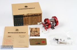 ABU Ambassadeur 2500C multiplying reel in nostalgia red finish, foot stamped 070008, twin handled,