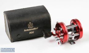 ABU Ambassadeur 5000 bait casting reel in red and chrome, foot stamped 107100, counterbalance