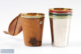 Set of 4 gilt lined with enamelled edge shot stirrup cups, in leather case holder marked made in