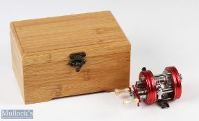ABU Ambassadeur 1500C multiplier reel in nostalgia red 1998 numbered to foot 070008, silver colour