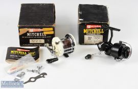 Garcia Mitchell 602 multiplier saltwater reel in white and chrome finish, counterbalance handle with