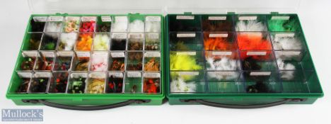 A plastic display case with 32 compartments, with trout lures made up of Ace of Spades / Baby Doll /