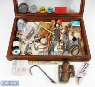 A treasure trove of fishing accessories in a large (19