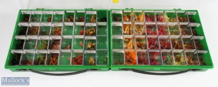 A plastic display case with 32 sections with salmon double flies, made up of stoats tail / thunder