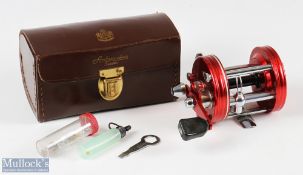 ABU Ambassadeur 6000 multiplier reel in red stamped to foot 010600, black counterbalance handle,