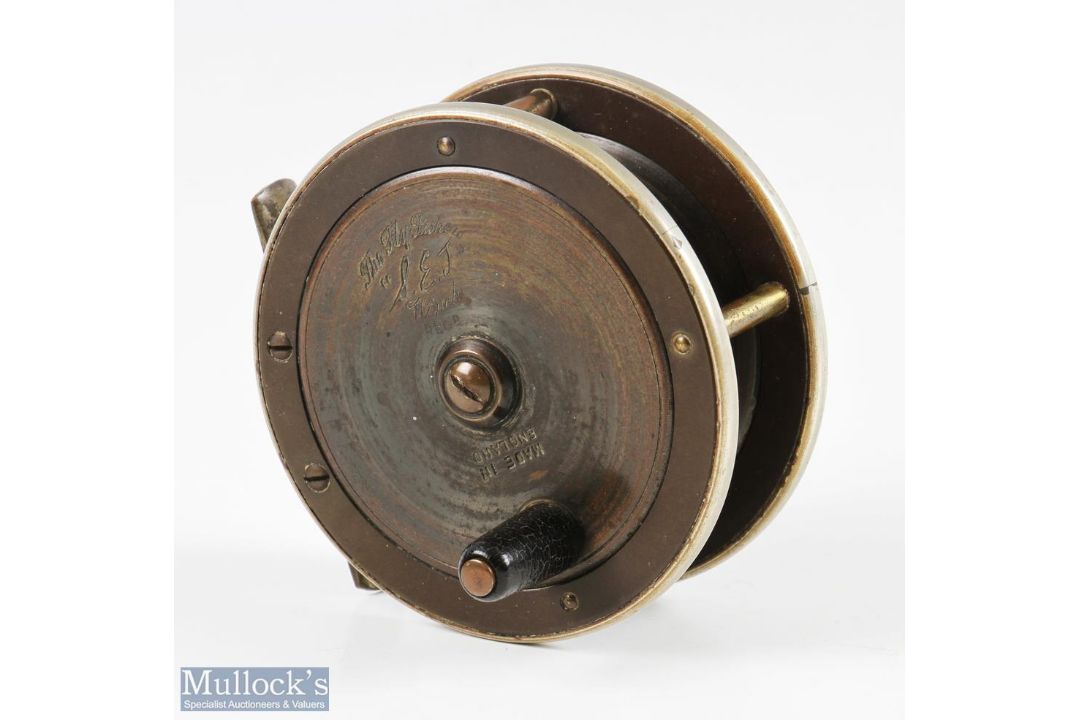 The Fly Fisher SEJ Winch 3 ¼” brass and ebonite reel, black handle, makers marks to brass faceplate, - Image 1 of 2