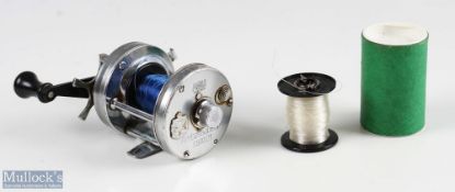 ABU Ambassadeur 6500CT multiplier reel, in silver finish, numbered to foot 751101, twin black