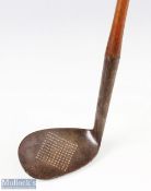 Dished Face Danga wood niblick with square patterned punch dot holes to curved face, indistinct