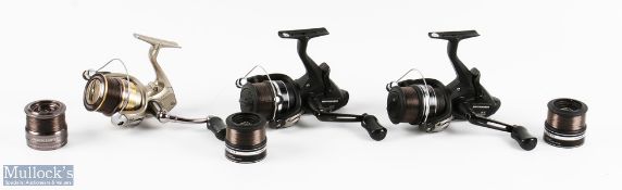 A collection of Shimano fixed spool spinning reels, all with spare spools and in zip cases,