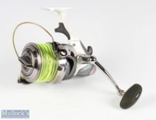 Okuma Axeon AXS-65 long distance surf reel, good bail arm, runs well, in original zipped case