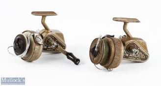 2x JW Young Ambidex fixed spool reels both with full bail arms, in champagne colour, one with