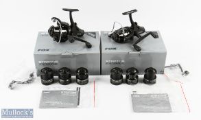 Pair of Fox Stratos FS4000E fixed spool reels: both look unused with 2 spare spools, spare handle,
