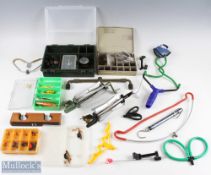 A treasure trove of course fishing accessories, made up of hooks, plugs, weights, tackle cases,