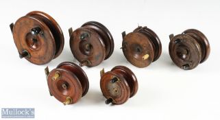 A collection of traditional mahogany and brass reels: all requiring a little attention