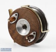A very interesting unnamed brass, wood and alloy star back reel, 3 1/2