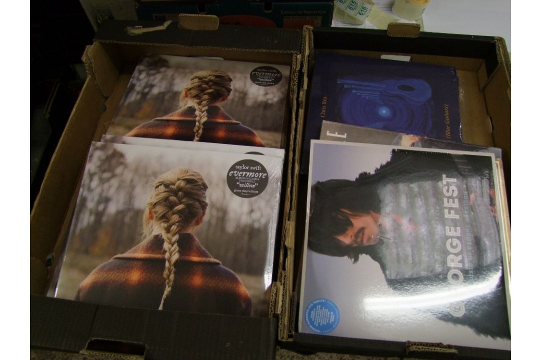 A collection of vinyl records to include Taylor Swift Evermore green vinyl edition x 11, plus