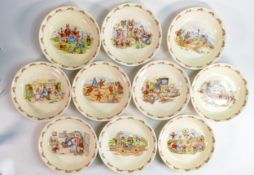 Ten Royal Doulton Bunnykins shallow bowls, 3 Barbara Vernon signed items noted, each 19cm. (10)