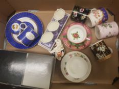 A mixed collection of items to include Wedgwood Mugs & Saucers, Commemorative items, Coalport Candle