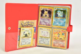 A FOLDER CONTAINING A QUANTITY OF POKEMON CARDS, containing a complete Base Set collection, and