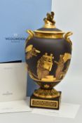 A BOXED WEDGWOOD MASTERPIECE COLLECTION LIMITED EDITION BLACK BASALT AND GILT PEGASUS VASE AND