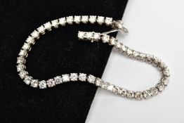 A MODERN PLATINUM DIAMOND LINE BRACELET, set with fifty-two round brilliant cut diamonds, four
