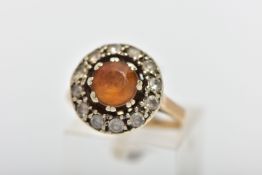 A YELLOW METAL CLUSTER RING, of a circular form, designed with a double eight claw set, circular cut