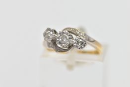A YELLOW METAL THREE STONE DIAMOND RING, designed with three graduated, round brilliant cut