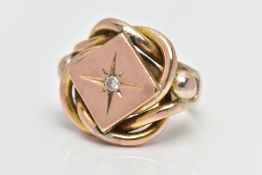 A LARGE 9CT GOLD GENTS RING, designed as a reef knot with accent ball details, centrally