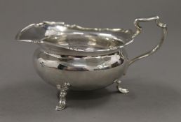 A silver cream jug. 7 cm high. 142.5 grammes.