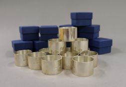 A set of twelve silver napkin rings. 787.8 grammes.
