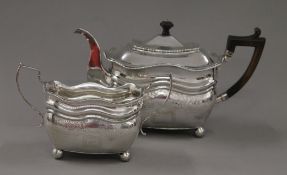 A Georgian Irish silver teapot and associated sugar bowl. The former 17 cm high. 918.