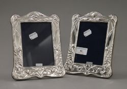 A pair of silver photograph frames. 20.5 cm high.