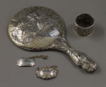 A repousse silver napkin ring hallmarked Birmingham 1891, silver Whisky and Sherry decanter labels,