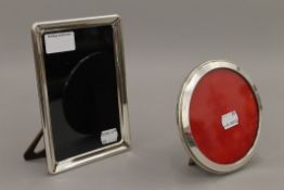 Two silver photograph frames, one oval and one rectangular. The latter 17 cm high.