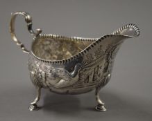 An embossed Irish silver sauce boat. 15.5 cm long. 145.3 grammes.