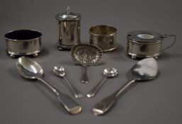 A cased silver cruet set, spoons and a napkin ring. 167.8 grammes.