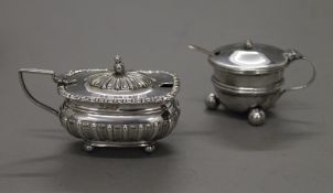 Two silver mustard pots. 89.6 grammes.