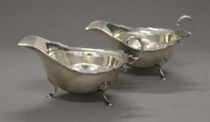 A pair of silver sauce boats. Each 14.5 cm long. 5.7 troy ounces.