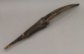 An African carved antelope mask. 73.5 cm high.